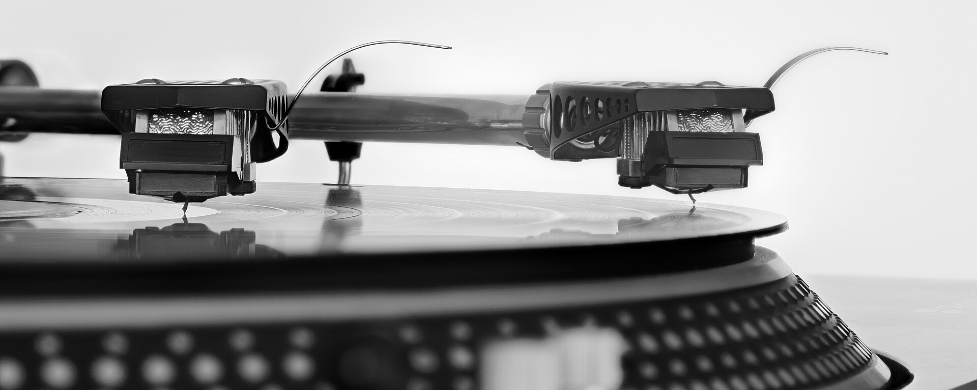 A stylus sitting in a record groove, photographed close up